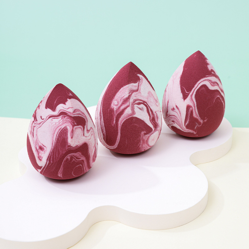 Maquillaje de belleza de color mixto, soplo de polvo de huevo, sin polvo, logotipo personalizado de fábrica, gota de agua sin látex, esponja de maquillaje en forma de calabaza, cojín de aire