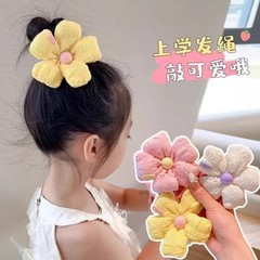 2025新型の早春のかわいい甘美な花のひもの女の子の高い馬尾の団子の頭は簡単で百合のヘアリングの髪飾りです。