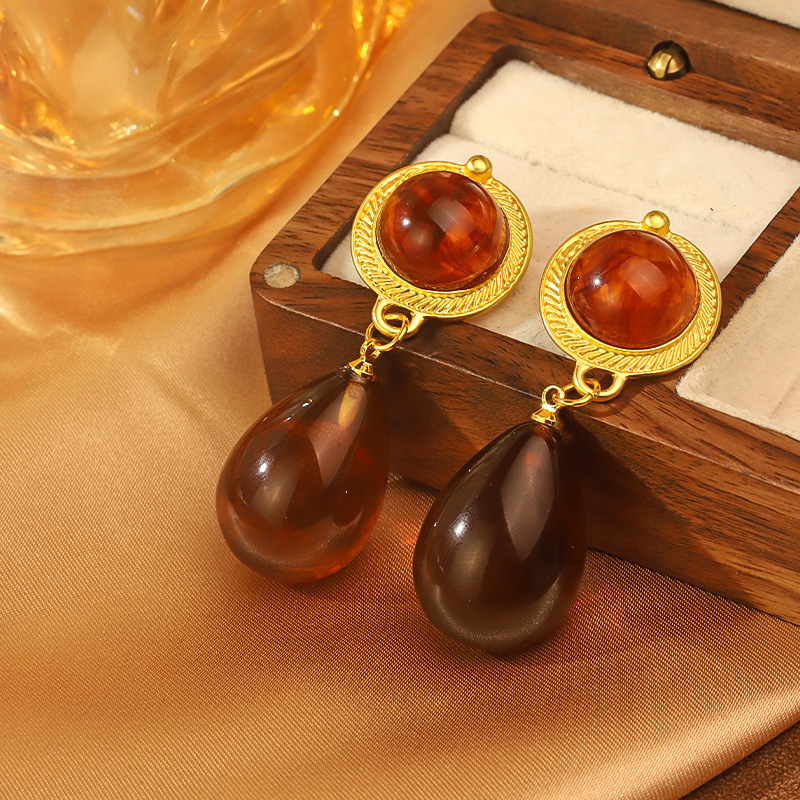 Retro ondulado ámbar aretes de gota de agua lujo ligero de alto nivel nicho super temperamento encantador pendientes franceses de moda europea y americana