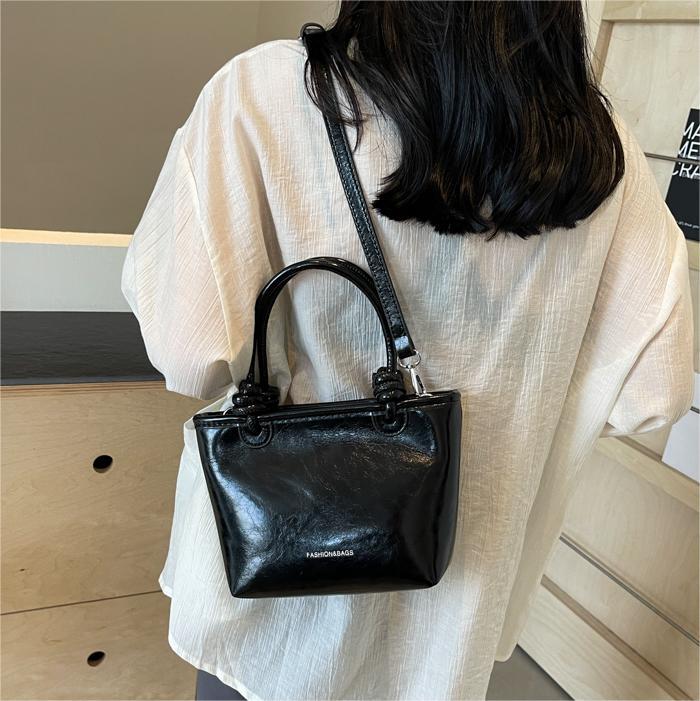 Moda nicho bolso de cubo de mano para mujeres 2024 nuevo estilo coreano simple bolso de hombro de diseño de alto nivel bolso de mochila