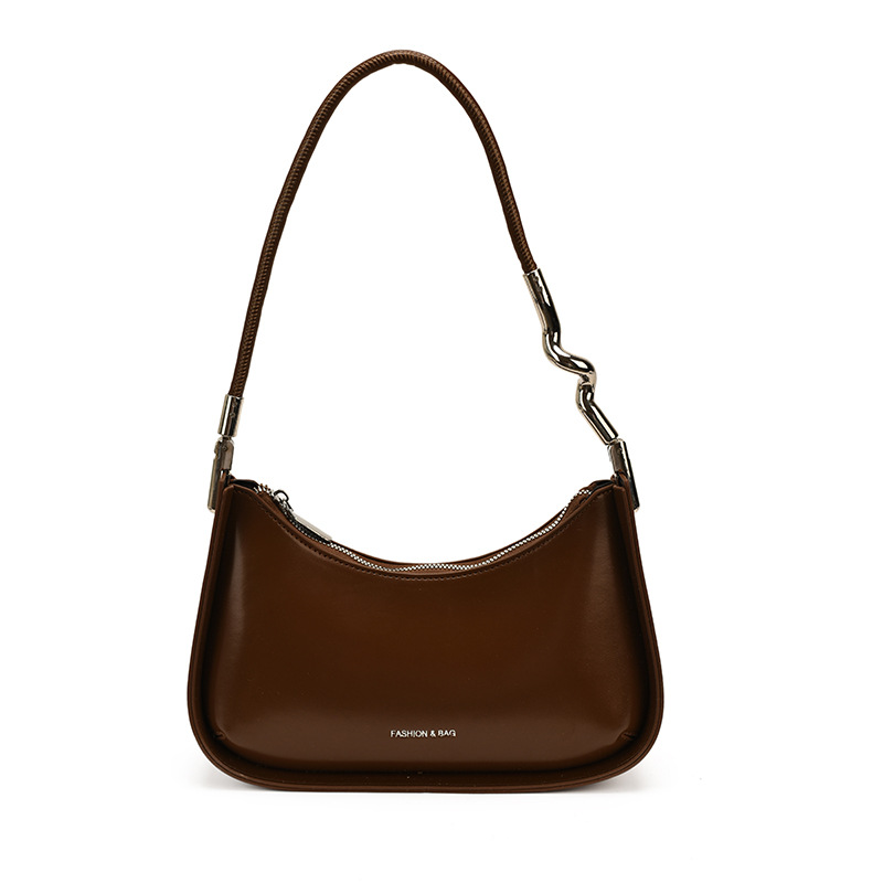 Nicho de diseño bolso de brazo para mujeres 2026 comercio exterior nueva moda alta sensación de viaje simple bolso de media luna de hombro