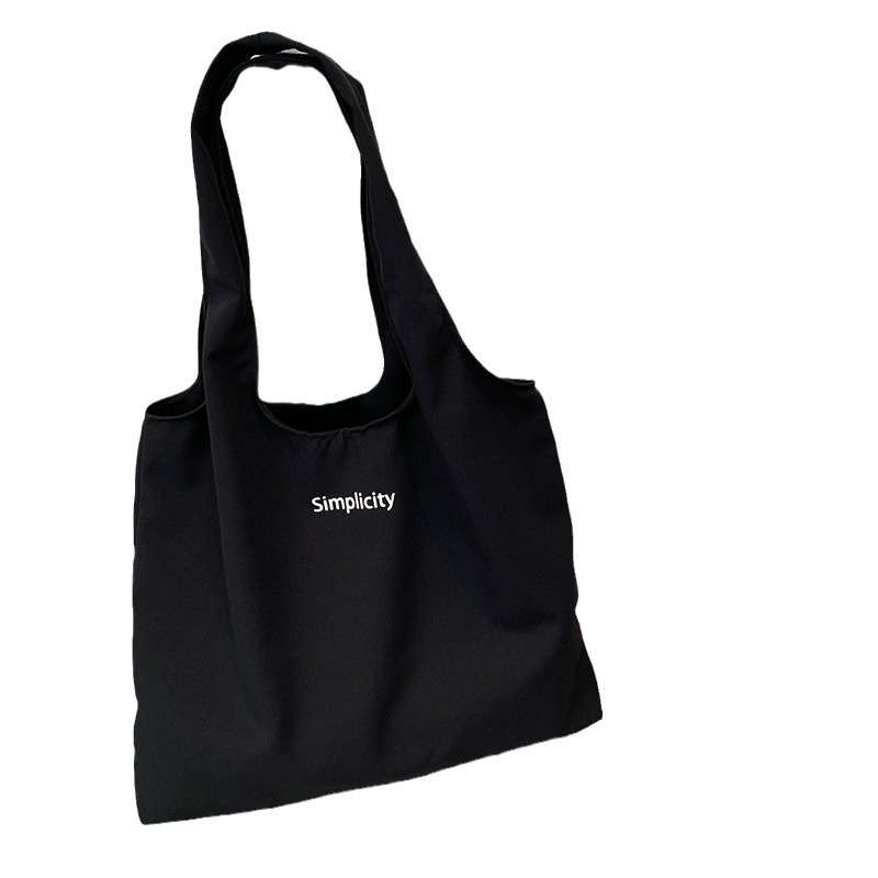 秋冬キャンバスバッグ黒色アルファベットベストバッグ大容量旅行休暇バッグ学生授業バッグバッグショッピングバッグ