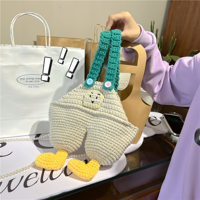 New creative hand-woven suspenders pants bag homemade handmade messenger bag wool crocheted girl milk tea shoulder bag