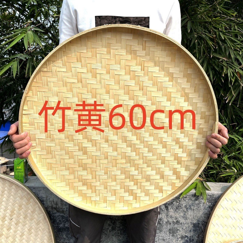 竹編み干し料理の神器と箕農家の竹編み製品の古い手作りふるいに穴があります。|undefined
