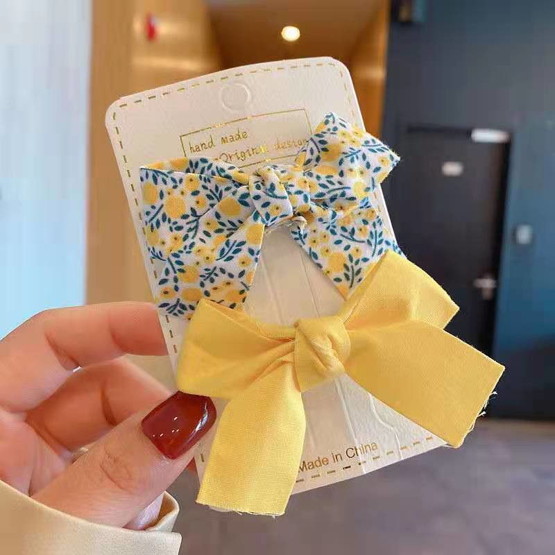 Estilo coreano fresco floral arco horquilla niños macaron color presión clip flujo mar clip lateral traje accesorios para el cabello