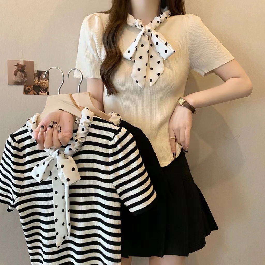 Knitted summer cute sweater with bow with a round collar