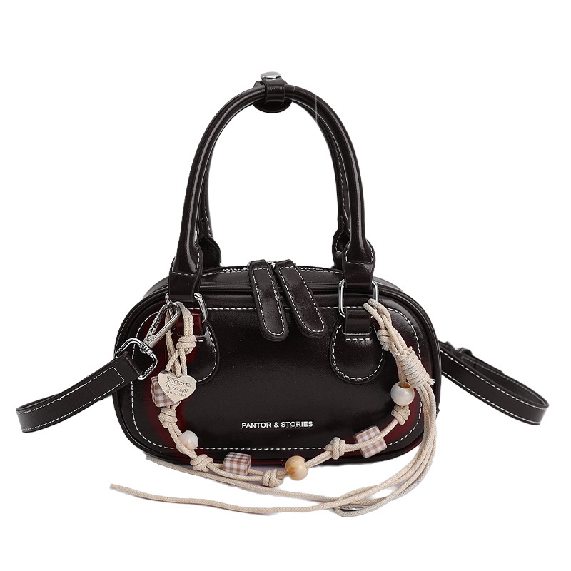 Bolsa de hombro coreana de diseño de nicho simple 2026 nueva moda femenina de tendencia diaria textura de viaje popular bolso de hombro