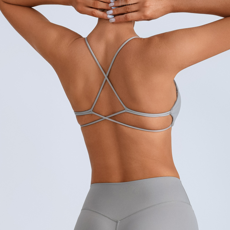 Traje de yoga europeo y americano transfronterizo, espalda hermosa con almohadilla para el pecho, sujetador con tirantes cruzados, pantalones deportivos de secado rápido de melocotón de cintura alta