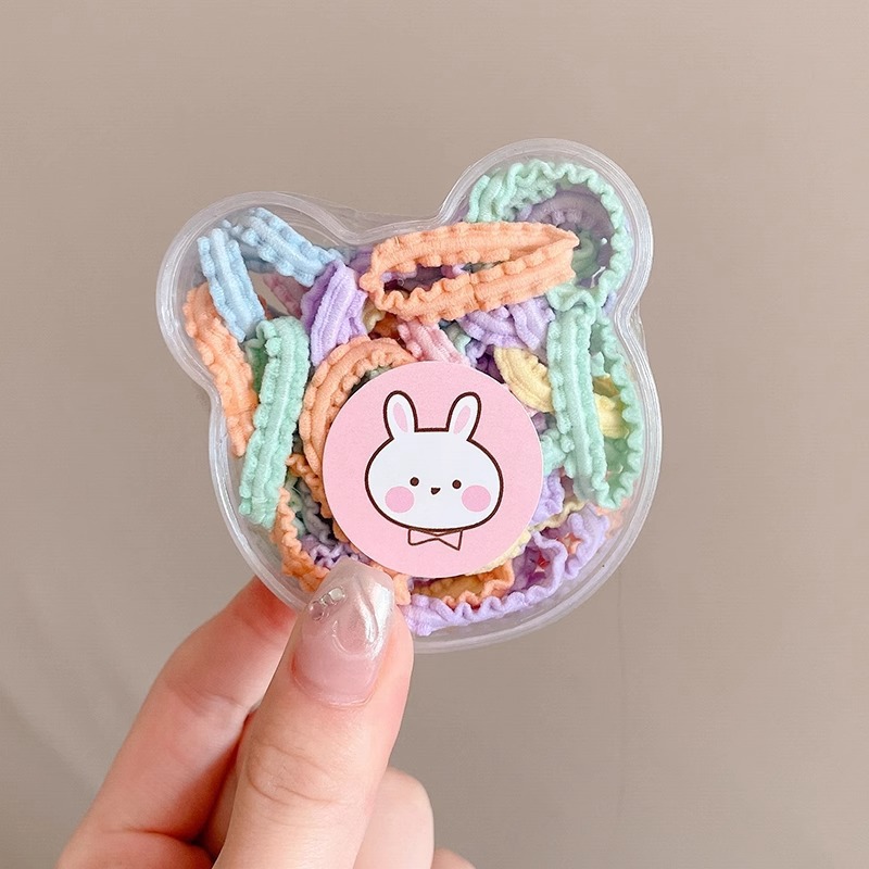 Las muchachas de la cuerda del pelo del color del caramelo no hacen daño al pelo pequeña tira de goma Lazo de la cuerda del pelo tocado niños lindos cubierta de cuero de la banda del pelo del bebé