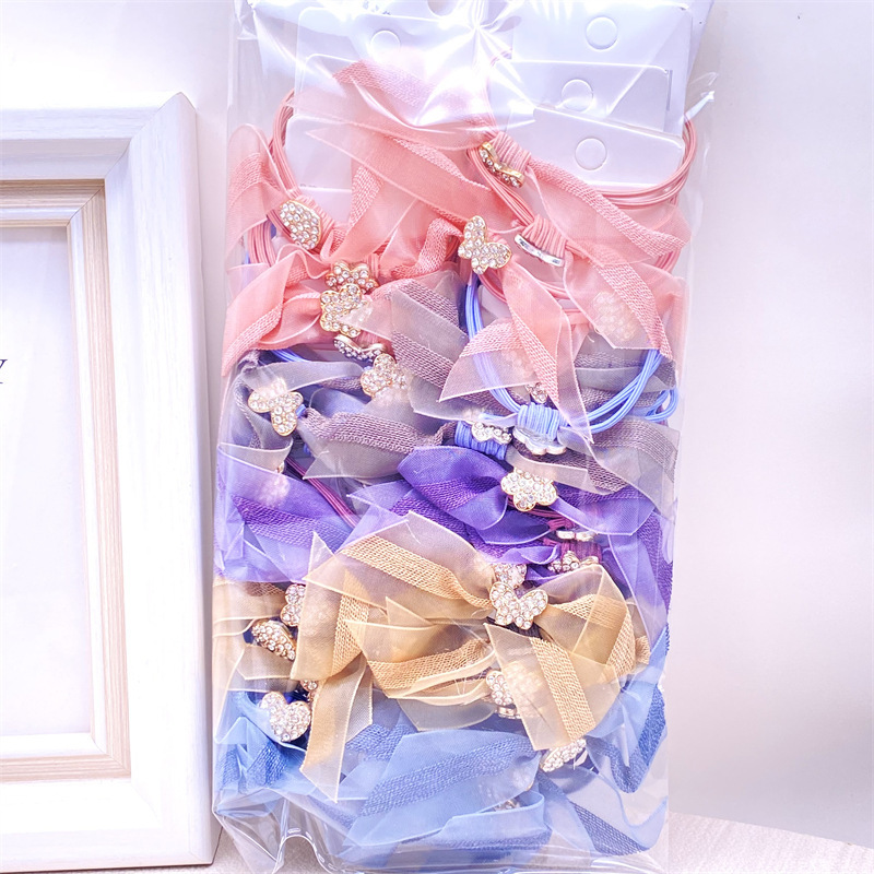 La versión coreana de la tarjeta colgante de té leche adornos de cabello nudo cinta de cuentas de cuerdas de alta elasticidad cuatro en uno correa de goma 2 tienda