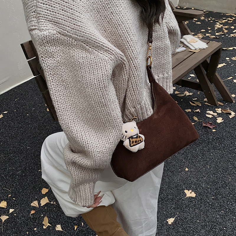 Alta sensación retro bolso de mano de mujer 2025 nuevo hombro mochila de textura esmolada bolso de bolsillo