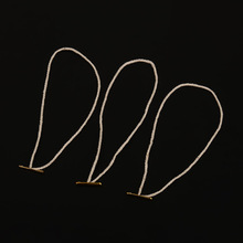 厂家定制箱包手工配件棉线黄色穿插吊粒服饰鞋帽固定挂件吊牌辅料