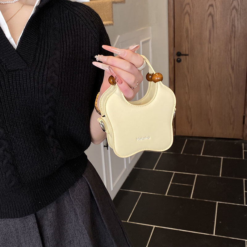 Bonita pequeña estrella en forma de bolso de hombro para niños y niñas, exquisita mini bolso de bebé, bolso para niños de comercio exterior transfronterizo