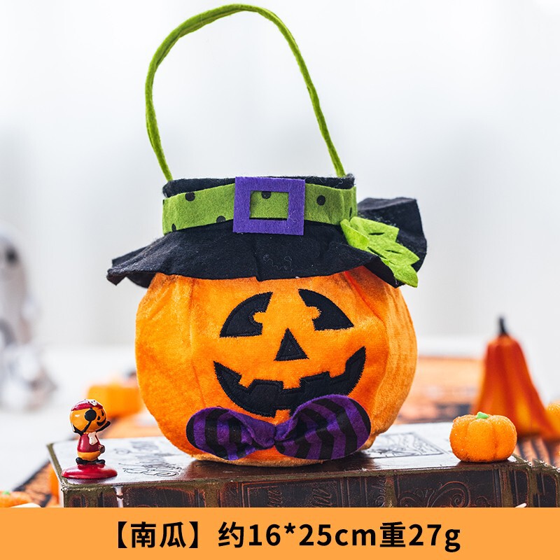 ハロウィーンのカボチャのバケツのキャンディーの袋のかごの子供の贈り物の贈り物は幼稚園の雰囲気を飾って飾っています。|undefined