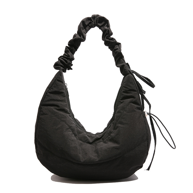 Bolso debajo de la axila para mujeres 2025 primavera nuevo diseño bolso plegado simple nicho bolso de hombro de mujeres