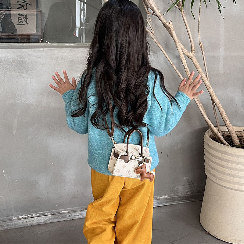 Impresión de moda coreana bolsos de chicas lindos colgantes de pony bolsos de hombro de aire extranjero mini bolsos de niños