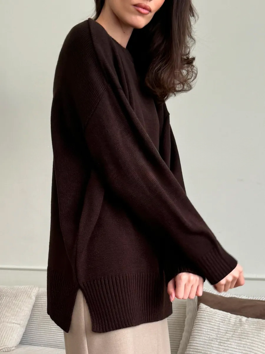 Suéter de cuello redondo transfronterizo Europa y los Estados Unidos 2025 otoño y invierno bifurcado camiseta de punto de color sólido universal cálido suéter casual mujer