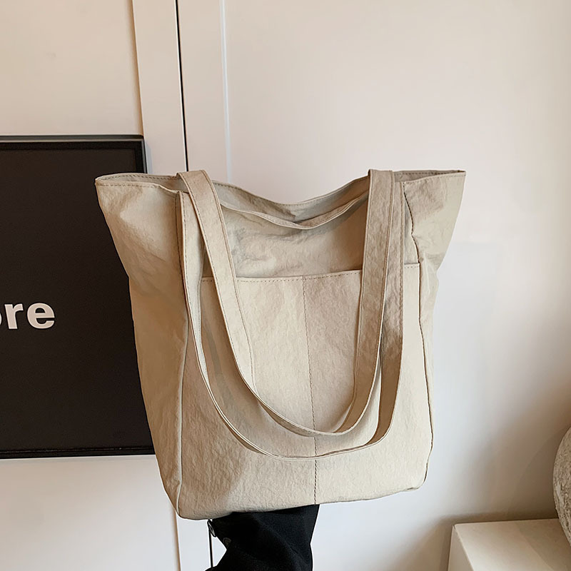 Bolsas de gran capacidad para mujeres 2024 verano nuevo bolsas de lienzo de clase nicho bolsas de hombro de moda