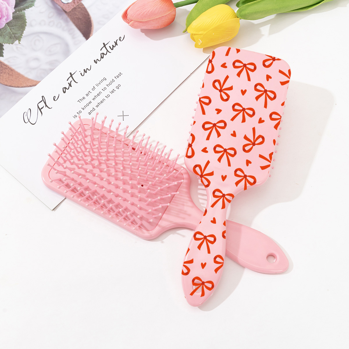 Estilo explosivo transfronterizo peine de colchón de aire con estampado de cereza con lazo lindo rosa peine de peluquería anti-nudo