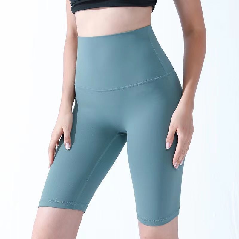 Pantalones cortos desnudos de mujer elásticos apretados para elevar las caderas de cinco puntos pantalones deportivos de secado rápido succión de sudor entrenamiento para correr fábrica de comercio de ping