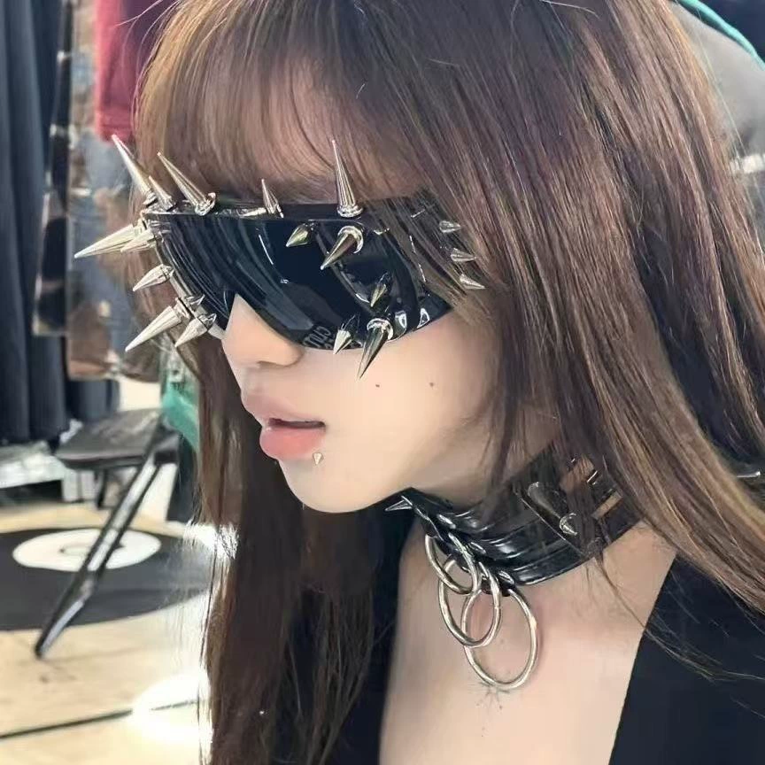 Sunglasses punk style, spike-studded fashion shades, black tinted lens