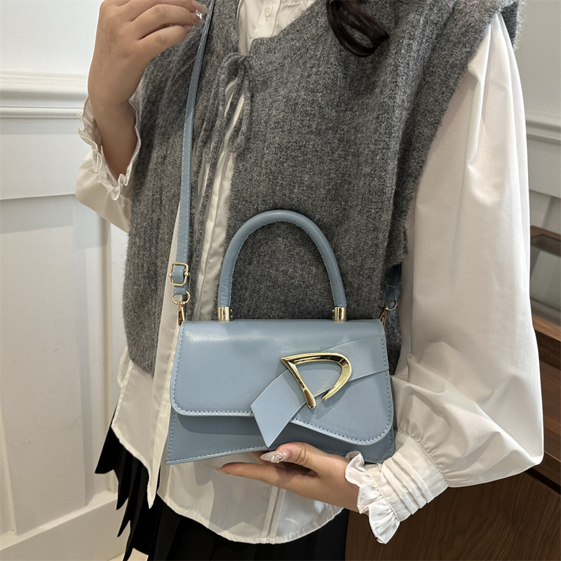 Bolso estilo occidental color sólido 2025 primavera nueva tendencia diseño de nicho personalidad tendencia pequeño bolso cuadrado simple bolso femenino