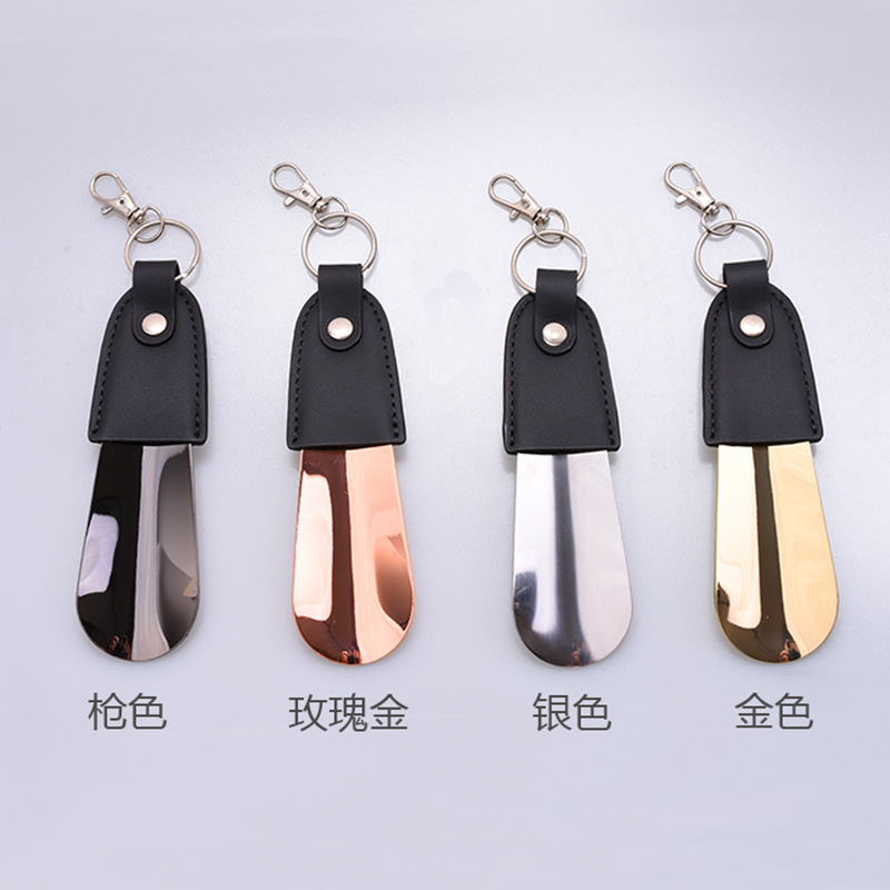 En stock suministro de acero inoxidable hebilla de llave tirador de zapatos con cubierta de cuero tirador de zapatos llave del coche colgante fácil de llevar levantador de zapatos