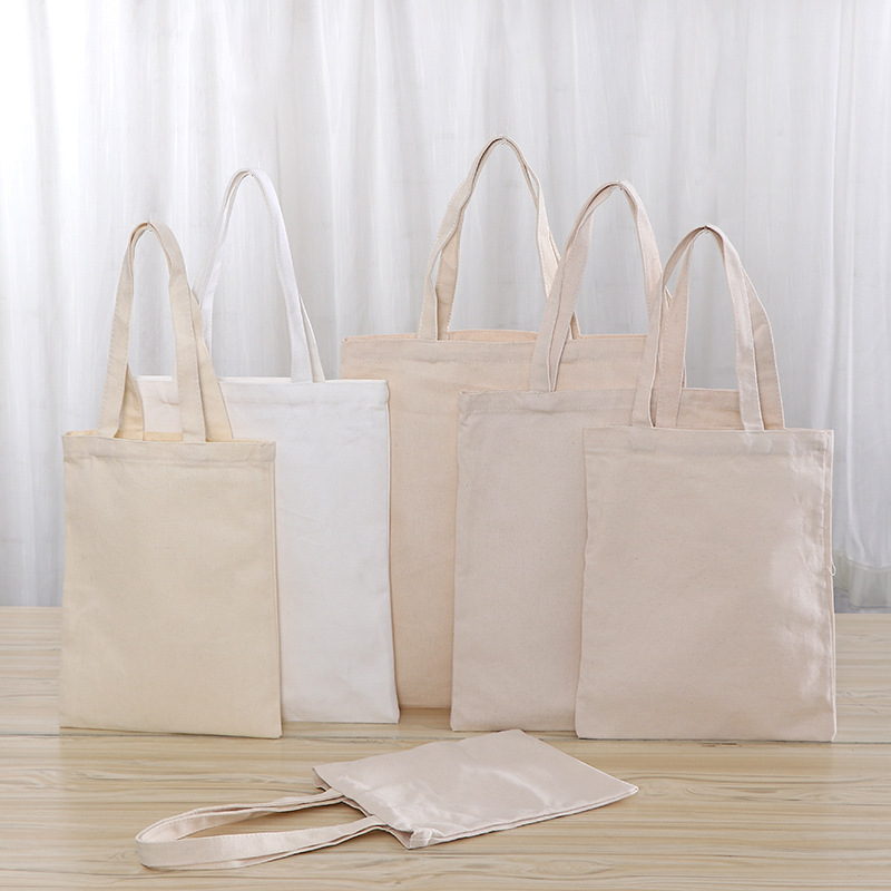 Gran capacidad estudiante portátil solo hombro en blanco color sólido bolsa de lona hombres y mujeres compras de algodón protección del medio ambiente bolsa de publicidad