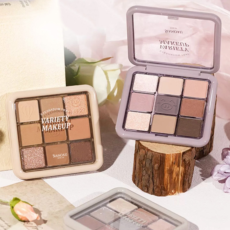 La nueva versión de la paleta de sombras de ojos de nueve colores Jiugongge perlado mate fino destello de sombra de ojos de 9 colores plato de barro de taro plato marrón naranja gran sitio femenino