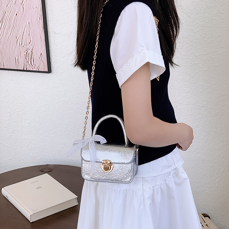 2026 bolso de niña pequeña mini bolso de cadena simple de color sólido bolso coreano nuevo bolso de cambio para niños