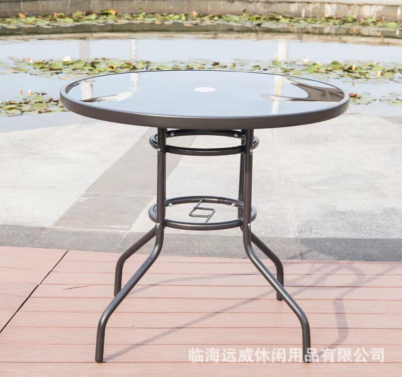 청동과 검은 색 유리 원형 테이블