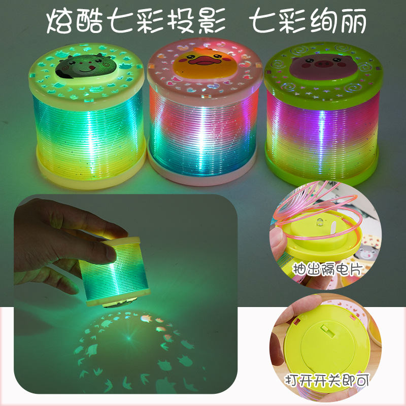 Tiktok misma proyección de dibujos animados Arco Iris anillo puesto juguetes luminosos al por mayor niños primavera anillo flash Jenga