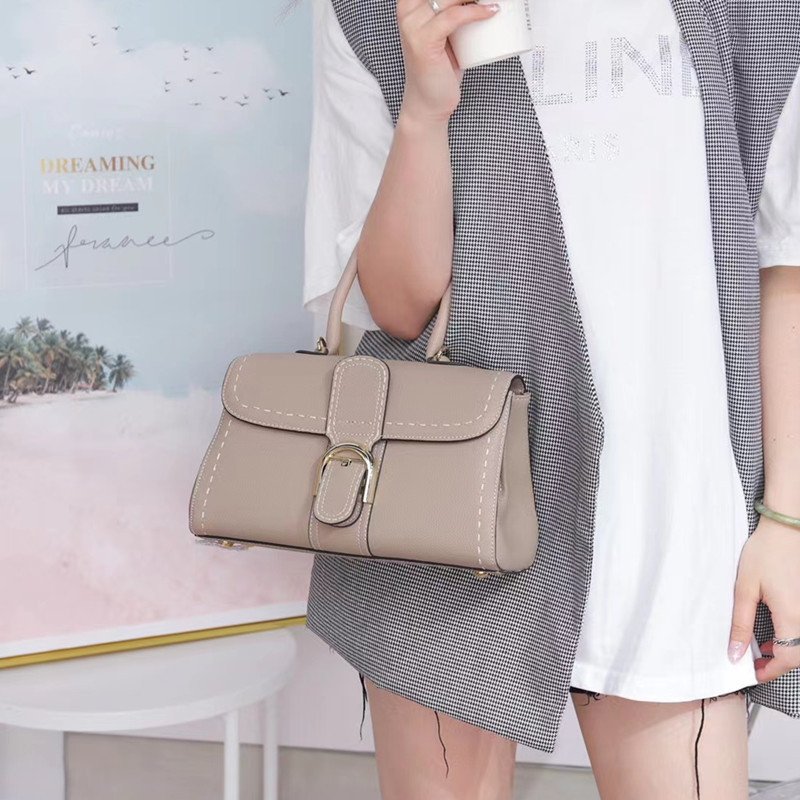 Bolso de mano con hebilla de herradura, modelo nuevo de 2025, bandolera de cuero de vaca granulado de primera capa, bolso de sillín informal y versátil.