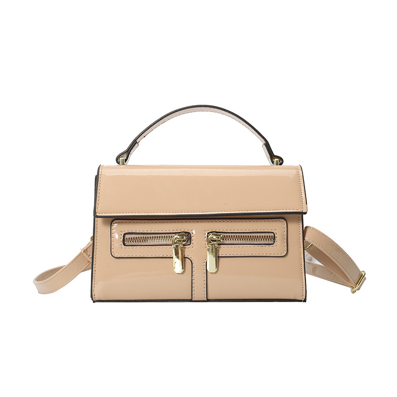 Bolso de diseño de nicho 2025 verano nuevo bolso femenino de alta calidad textura bolso de hombro charol brillante bolso de mensajero marea