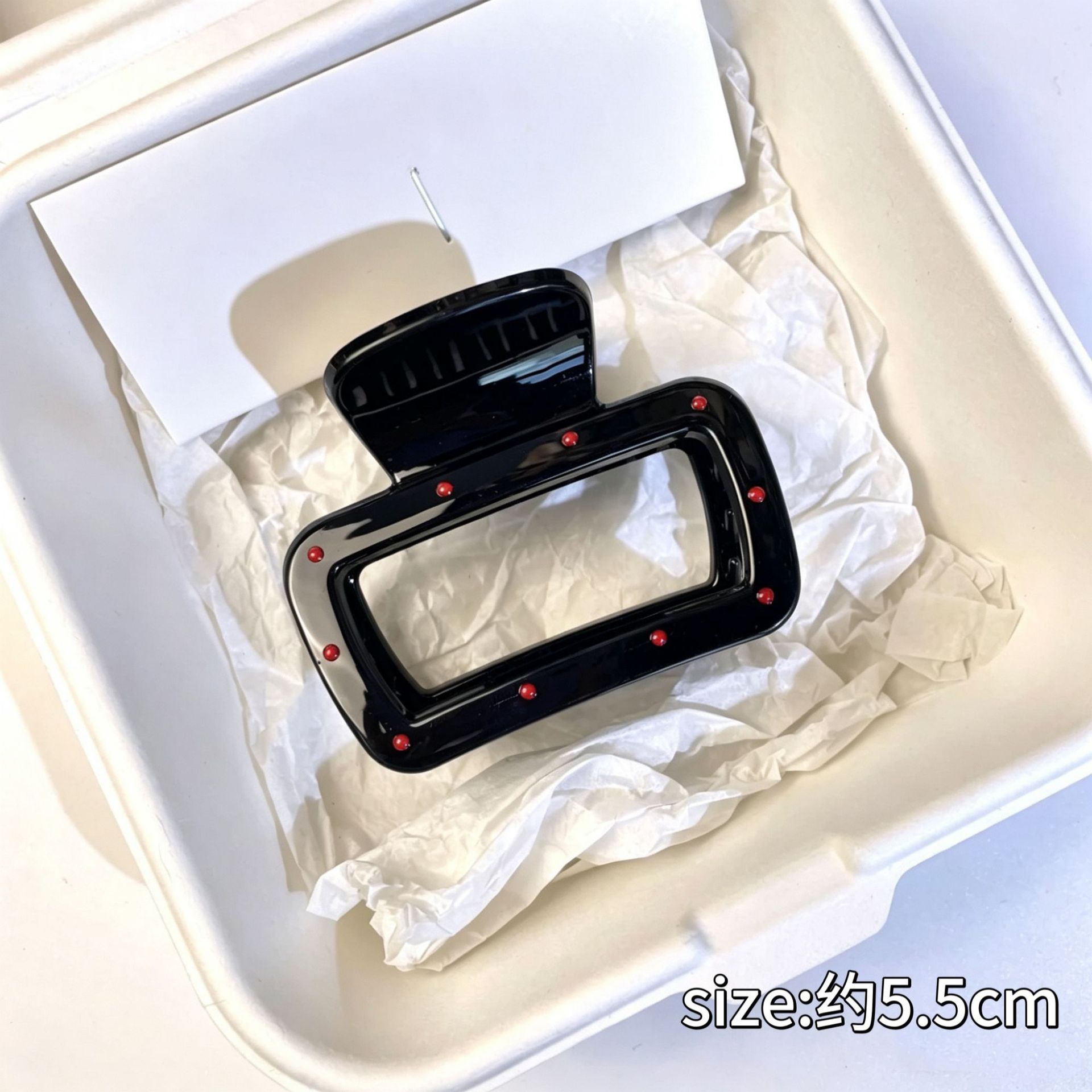 Small square with red dots on black background