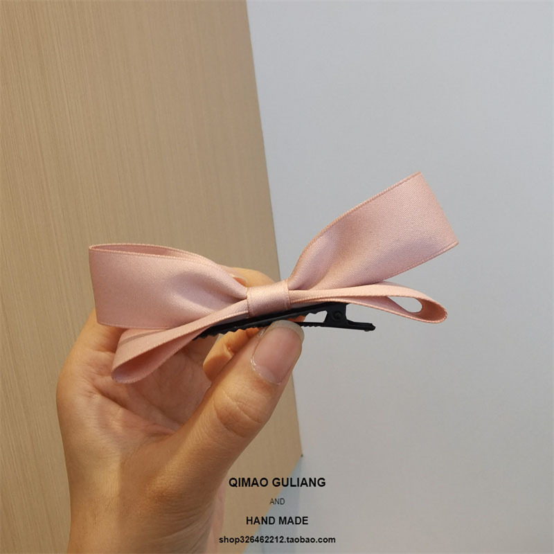 Pink three-dimensional bow