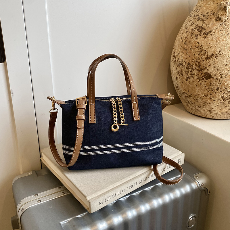 Tela estriada bolso de bolsillo de mano mujer 2026 venta caliente nuevo estilo de alta calidad sensación de moda versátil bolso de hombro