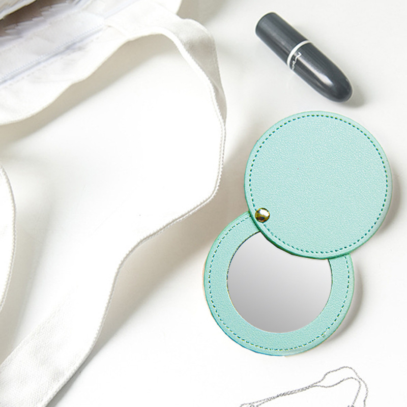 Regalo portátil pu maquillaje espejo moda publicidad regalo belleza espejo fábrica al por mayor giratoria cuero maquillaje espejo