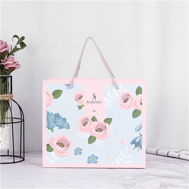 彩印牛皮纸手提袋白卡纸袋高档服装礼品包装袋购物袋可印 logo