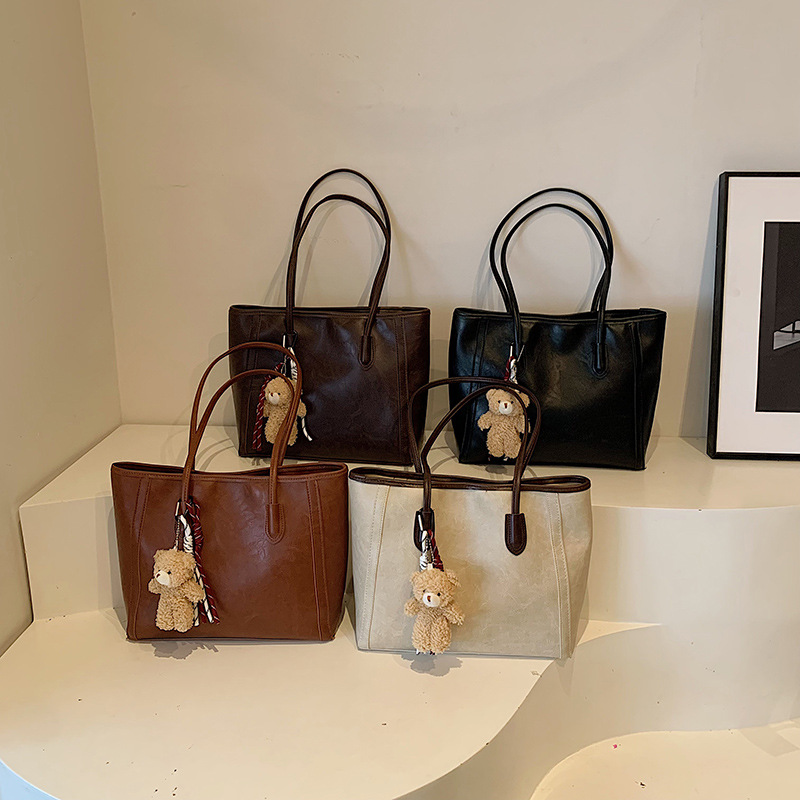 Bagos de textura de transporte aéreo 2024 otoño y invierno nuevo estilo coreano de moda bolso de hombro axilar temperamento bolso especial