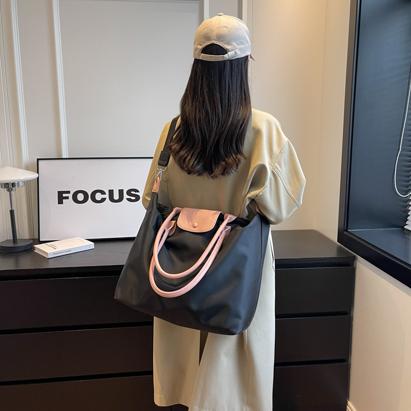 Bolsa de asas de gran capacidad de color sólido 2024 Nueva bolsa de viaje crossbody bolsa de equipaje de viaje de negocios de estilo coreano bolsa de almacenamiento simple