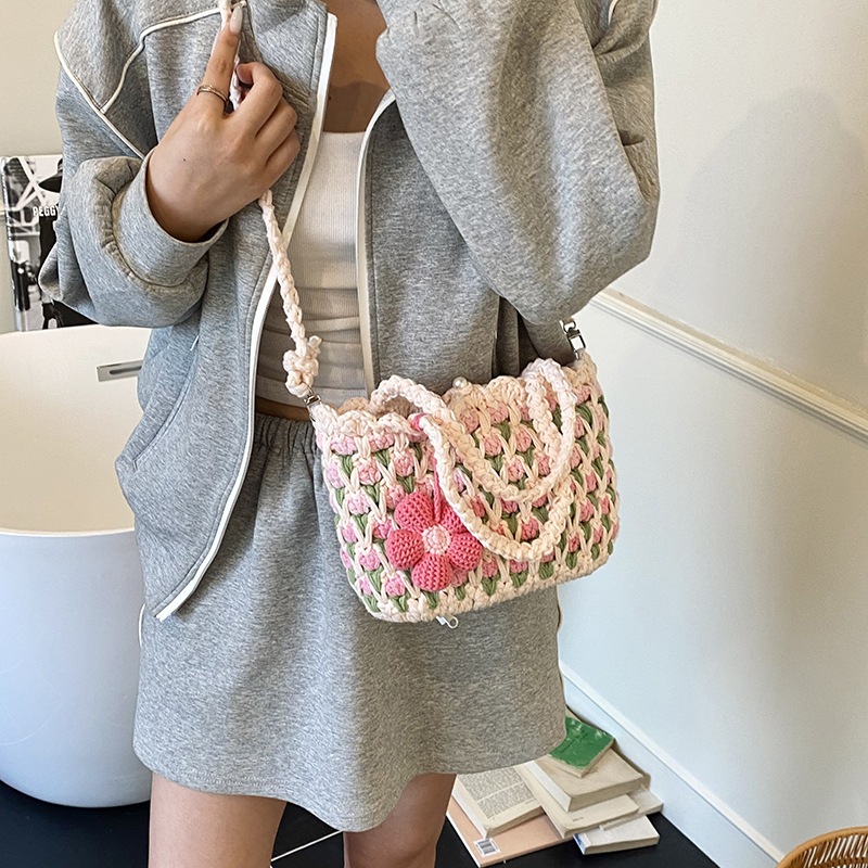 Nuevo paquete infantil transfronterizo ganchillo hecho a mano flores dulces bolsas de hombro para hombres y mujeres viajes de vacaciones bolsas de cestas de verduras portátiles