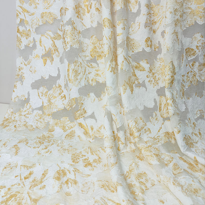 【】金色剪花面料人丝春夏裙装布料镂空不规则女装大提花色织复古