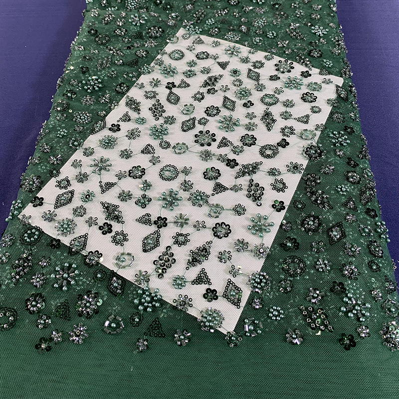 Tejido de bordado de tubo de perlas de lenteja tejido de bordado de malla láser tridimensional tejido de moda de vestido europeo y americano Gaoding