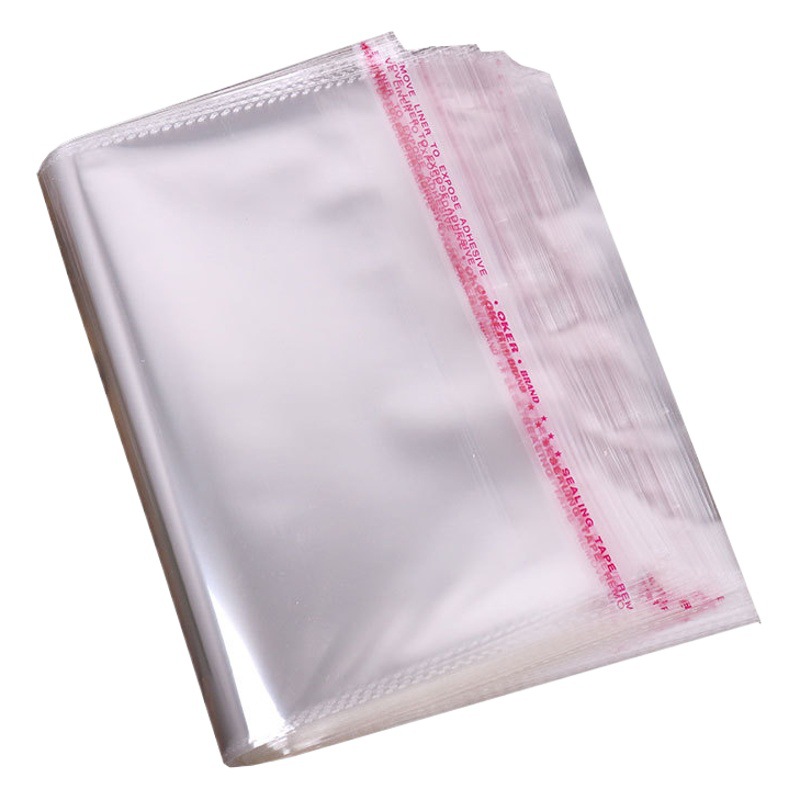 En stock OPP bolsa autoadhesiva bolsa de embalaje ropa bolsa de embalaje transparente máscara bolsa de plástico transparente producción al por mayor LOGOTIPO