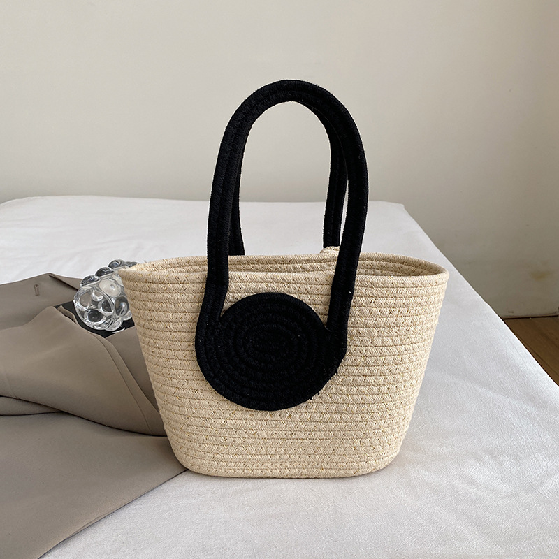 Bolsa de moda de color contrastante portátil de tejido de mujer 2025 tendencia primavera nuevo retro versátil arco bolso de cubo de mano