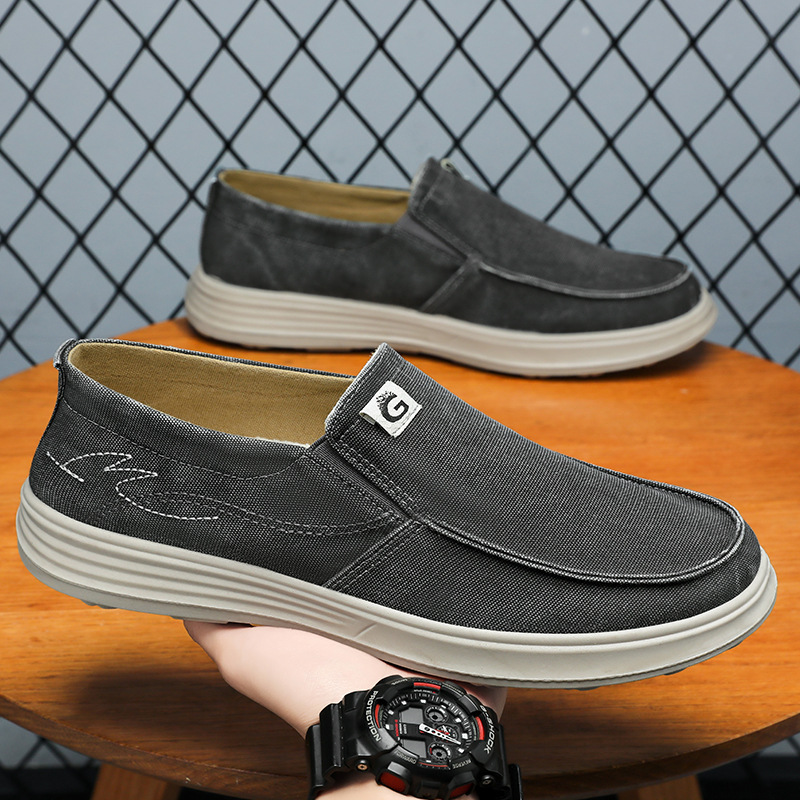 Zapatos para hombres de verano nuevos zapatos de lona al por mayor zapatos casuales de un pedazo de zapatos de trabajo transpirables coreanos viejos zapatos de tela de Beijing