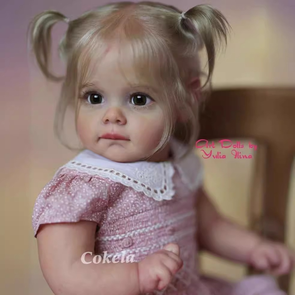 Cokela 58cm 3D simulación de alto color bebé renacido muñeca Maggi suministro transfronterizo entrega de una sola pieza