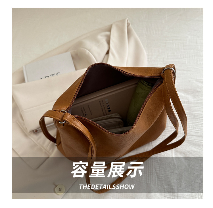 The 2024 new pleated tote bag is a large-capacity casual and fashionable backpack for women, featuring multi-functional texture and a single-shoulder crossbody bag undefined
