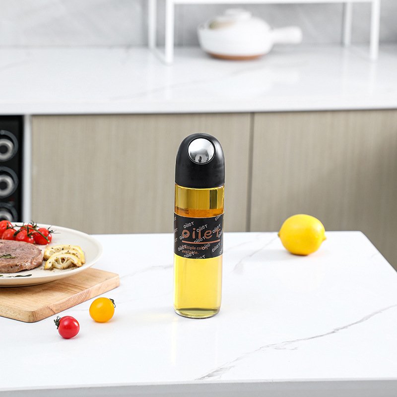 La nueva olla de aceite de vidrio de apertura y cierre automático, botella de condimento de cocina para el hogar, mayor capacidad, boquilla de aceite en forma de gota, tanque de vinagre de salsa de soja